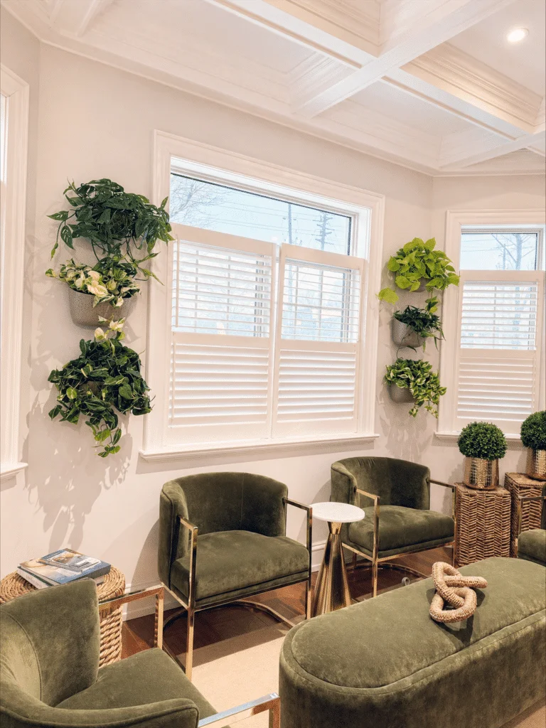 Green lounge chairs and natural light in the Preservation Haus reception